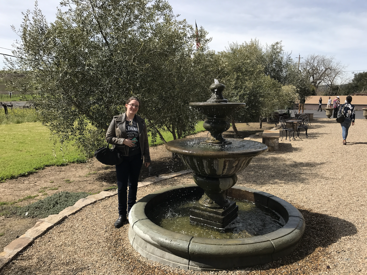Chelsi standing by a fountain in Sonoma County