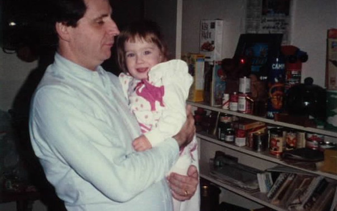 Doug holding Chelsi in the kitchen