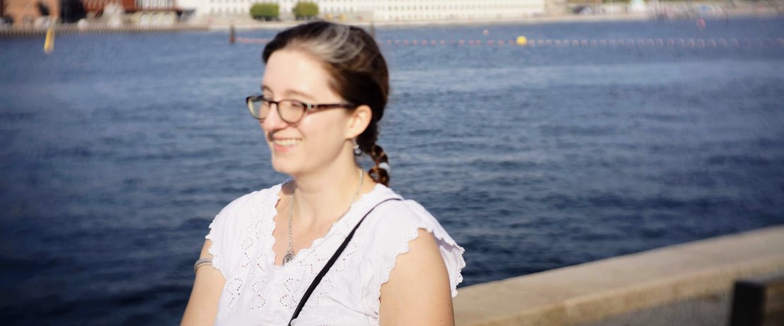 Chelsi walking along the pier by the opera house in Copenhagen