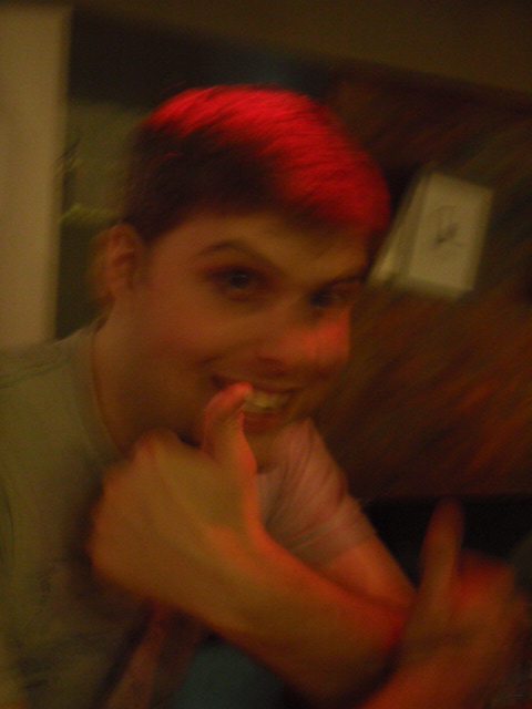 Blurry photo of Guy giving a thumbs up
