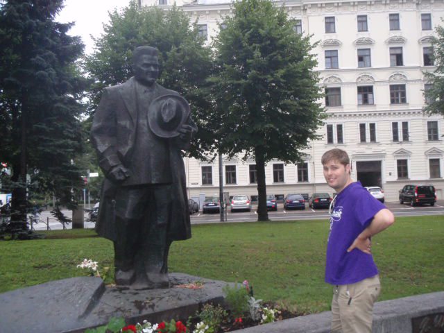 Guy looking at a statue