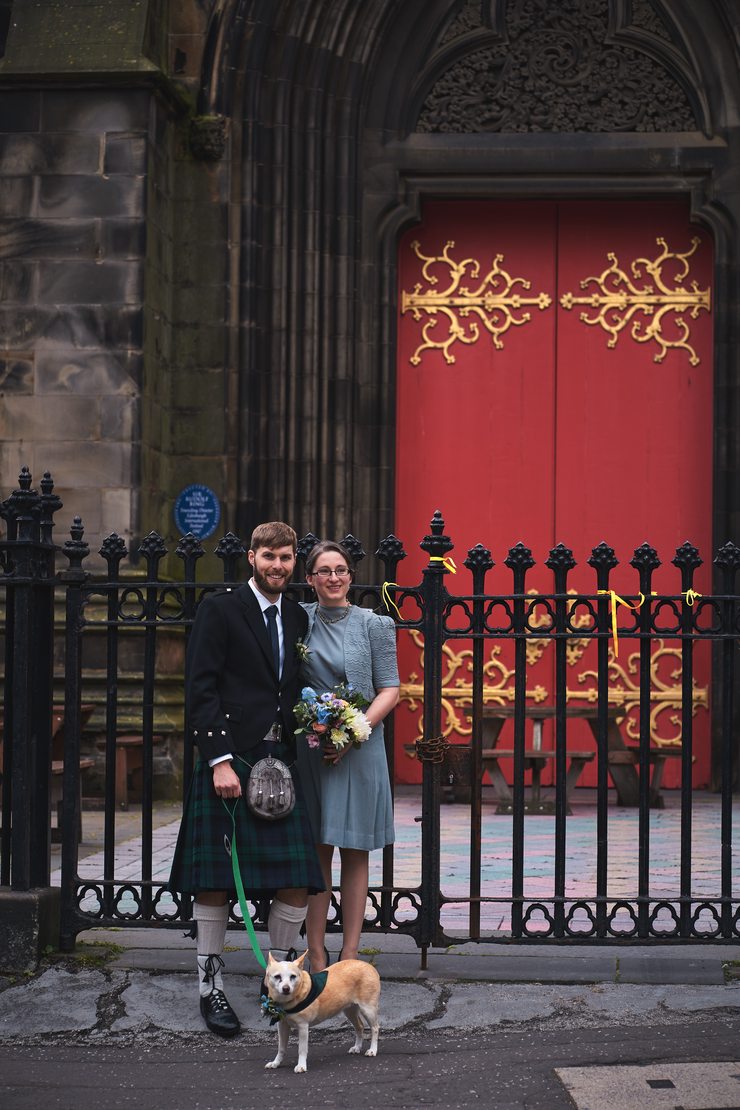 Chelsi and Guy in front of the main red doors.