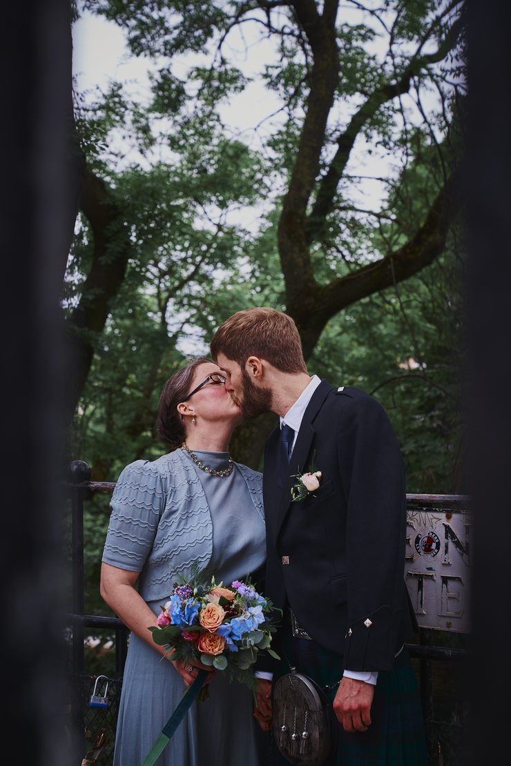 Kissing by the News Steps.