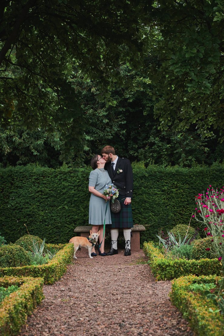Spice is more interested in the noises from the hedge than us kissing.