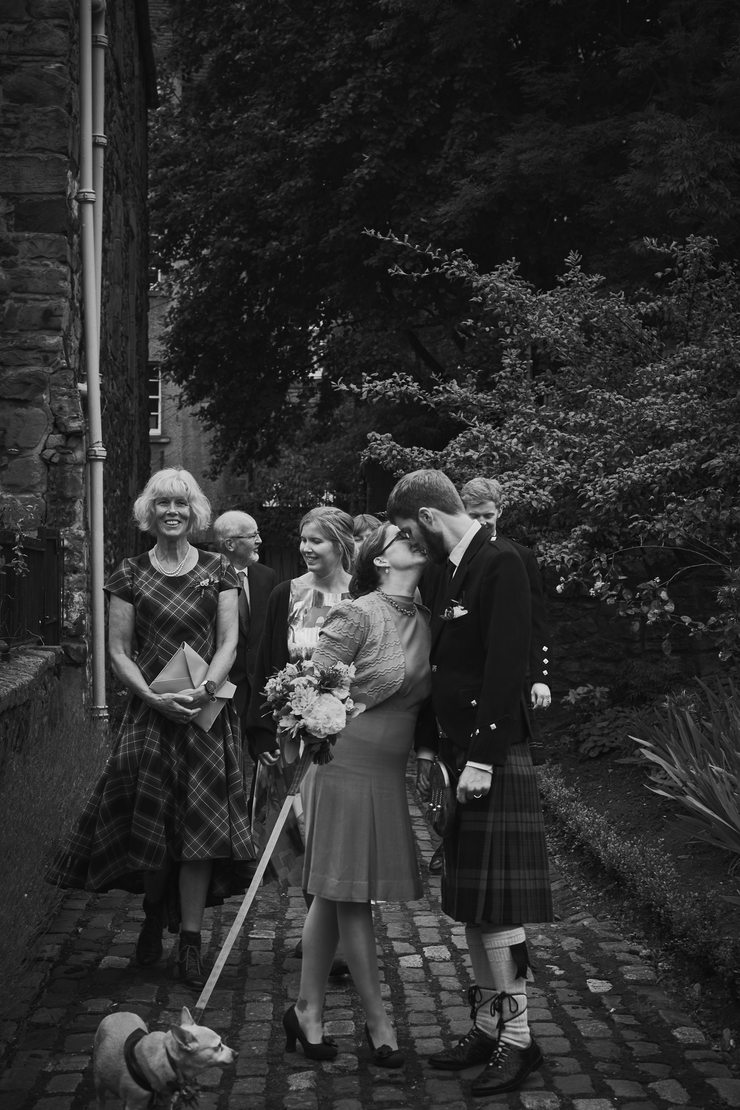 The last kiss before rushing to the reception.
